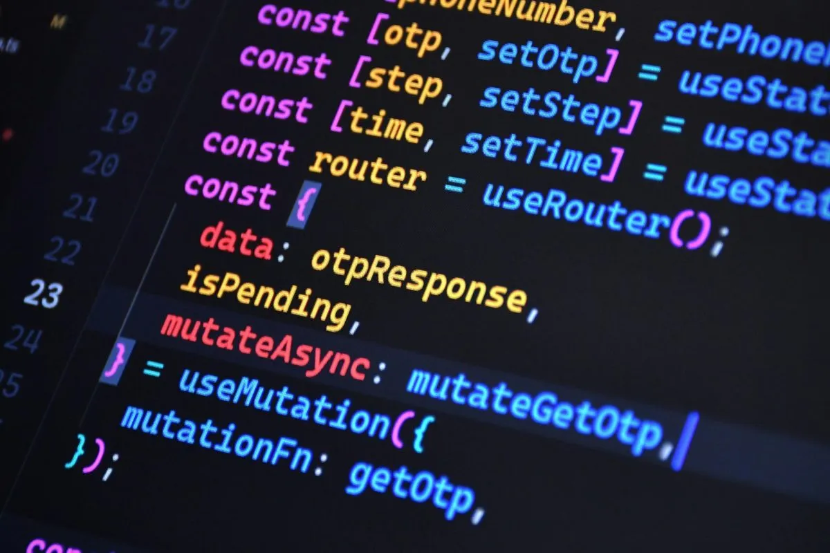 Close-up of vibrant JavaScript code for web development with ReactJS and Tailwind CSS.